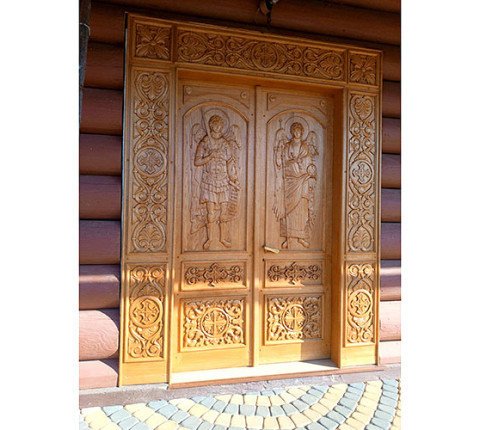 Carved church doors with archangels Michael and Gabriel