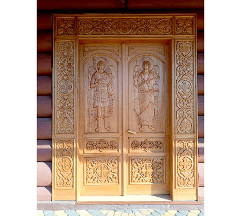 Carved church doors with archangels Michael and Gabriel