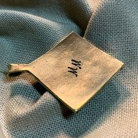 Handmade "Earth" pendant made of brass