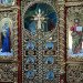 Дворядовий іконостас з вільхи з суцільним золоченням різьби на вишневому тлі