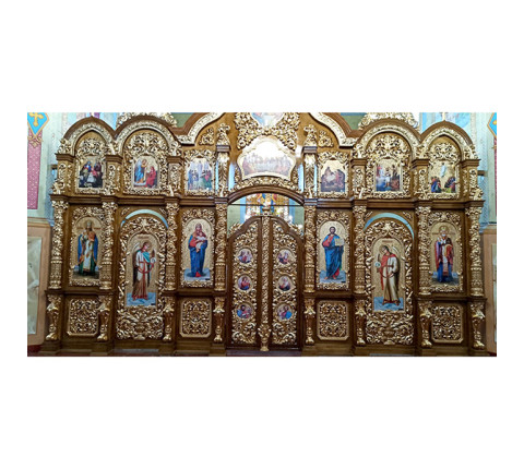 Two-tiered iconostasis made of alder with carvings and gilding with mirror gold.