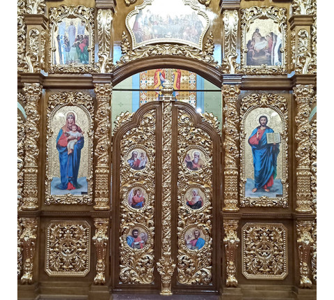 Two-tiered iconostasis made of alder with carvings and gilding with mirror gold.