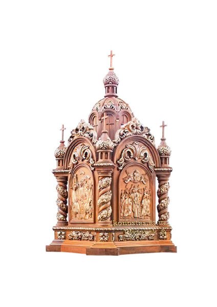 A wooden ark in the shape of a temple with gilded accents and narrative reliefs
