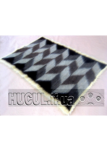 The "Waves of Cheremosh" blanket is handmade in black and white.