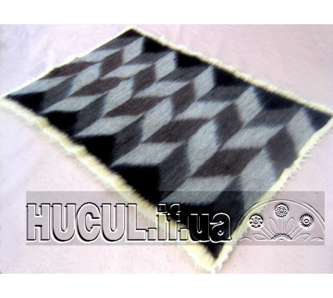 The "Waves of Cheremosh" blanket is handmade in black and white.