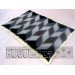 The "Waves of Cheremosh" blanket is handmade in black and white.