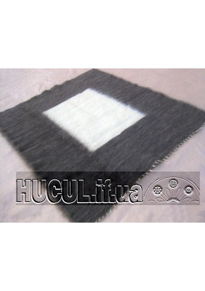 The "White Square" blanket is a black-and-white handmade item.