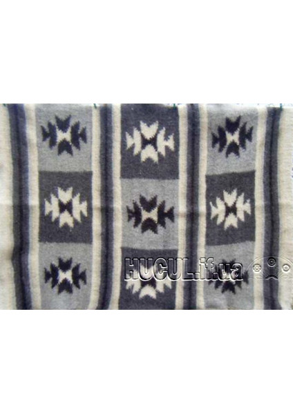 The "Burivka" blanket is black and white, handmade.