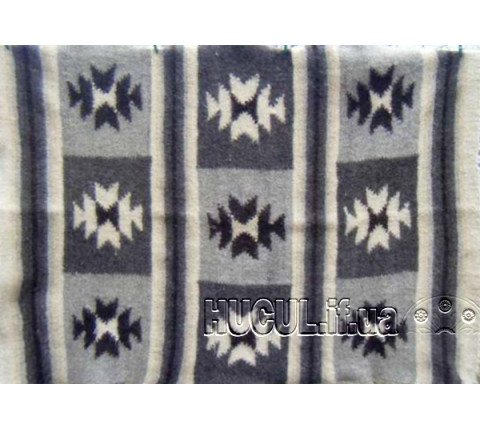 The "Burivka" blanket is black and white, handmade.