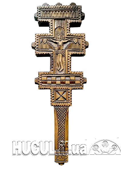 Cross with a carved image of the crucifixion of Christ