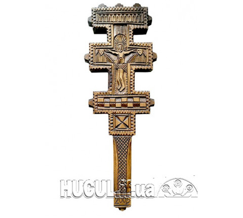 Cross with a carved image of the crucifixion of Christ
